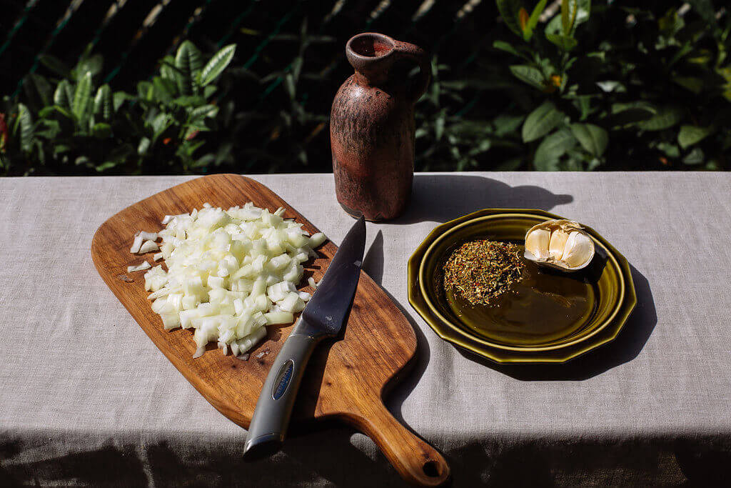 Once beef and pasta are done: In a pan, sauté the add the diced onions, herb blend, and minced garlic together, until onions turn slightly translucent.